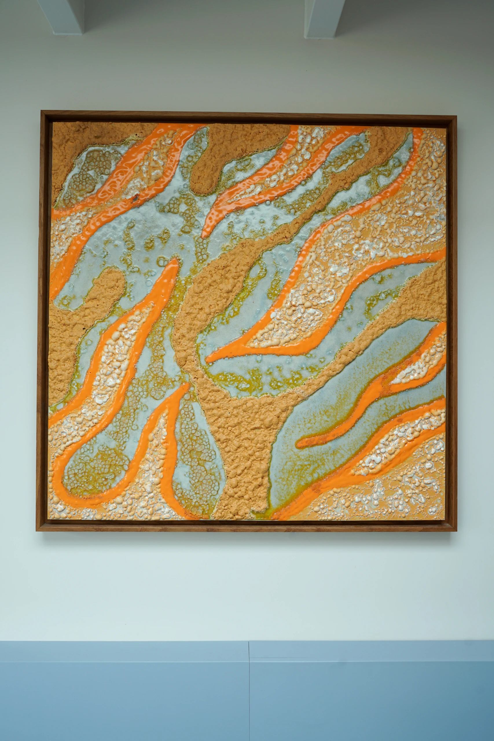 Orange Seas (2025), ceramic wall sculpture by Sjors Driessen combining glazed ceramic elements with American oak in a 93 × 93 cm composition.