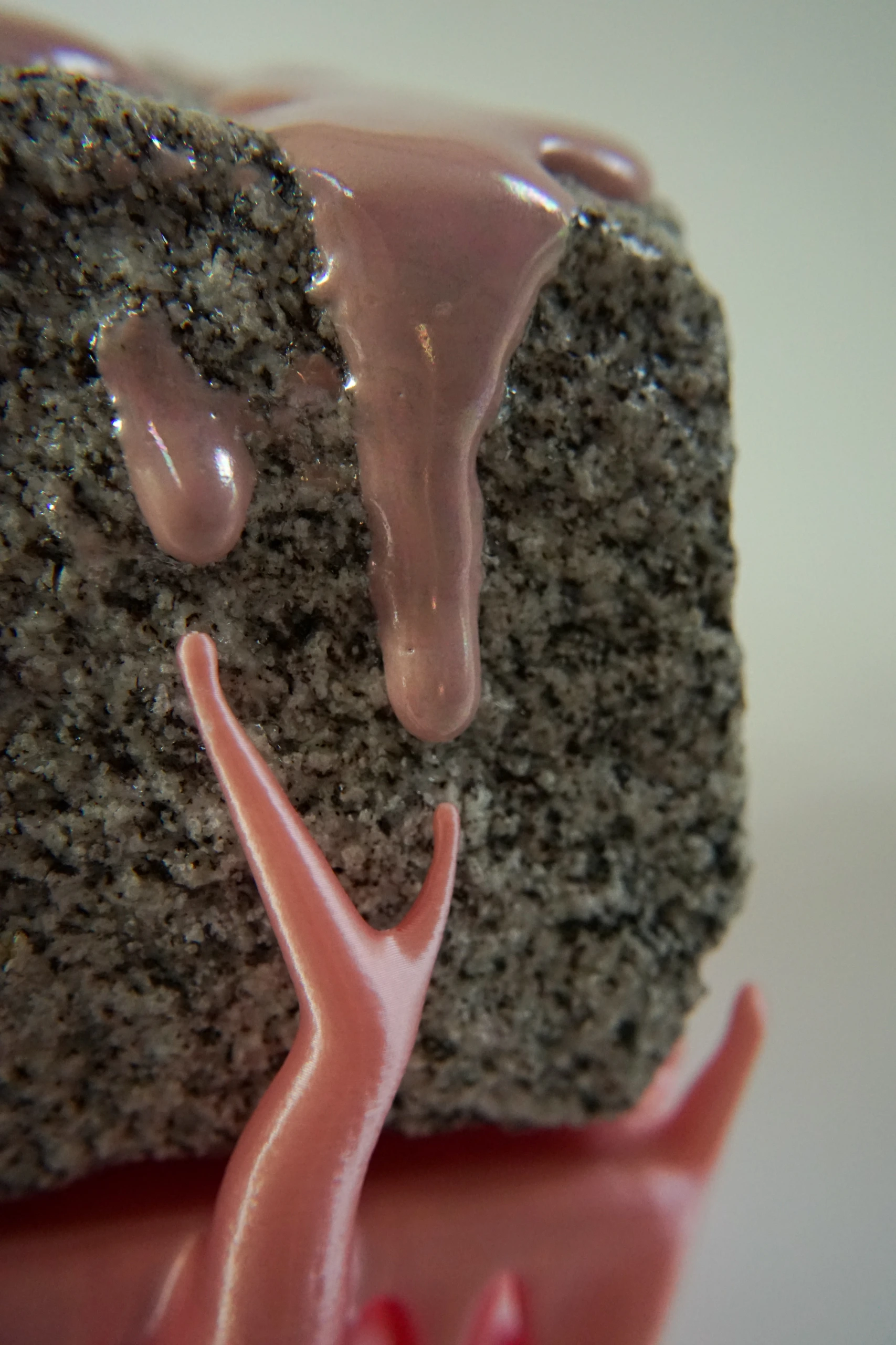 Pink Hyphae (2026), sculpture by Sjors Driessen combining granite with pink glaze and branching pink hyphae-like structures that appear to support and grow around the stone.