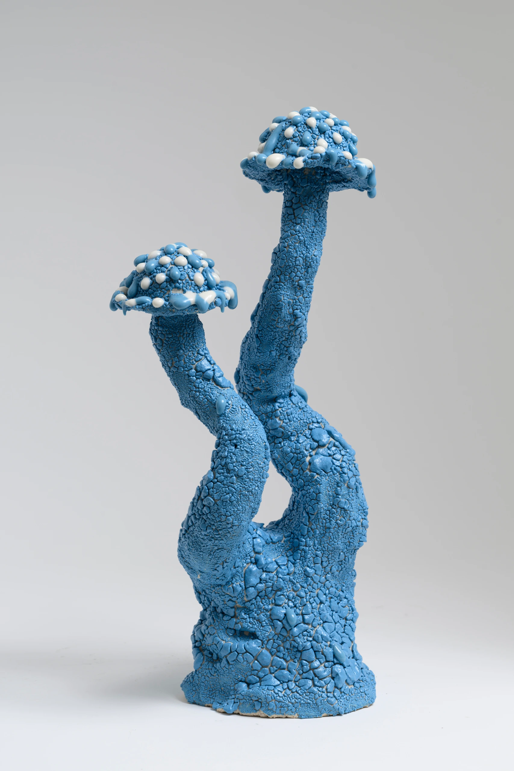 Blue Roundhead (2024), ceramic sculpture by Sjors Driessen with two elongated blue mushroom forms and textured glazed surfaces.
