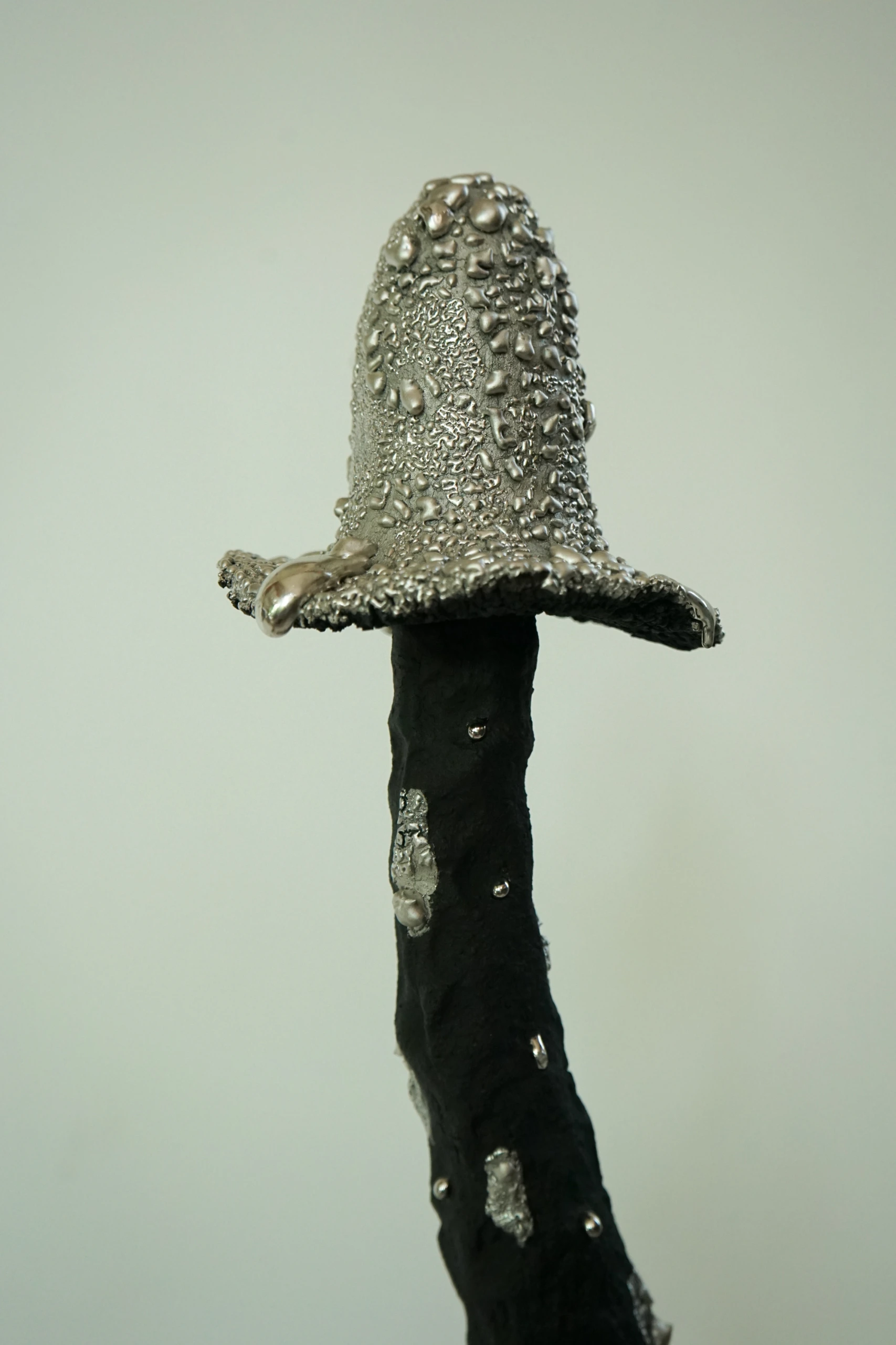 Silver Black Inkcap (2026), ceramic sculpture by Sjors Driessen with a tall dark mushroom-like form finished with textured glaze and reflective silver lustre.