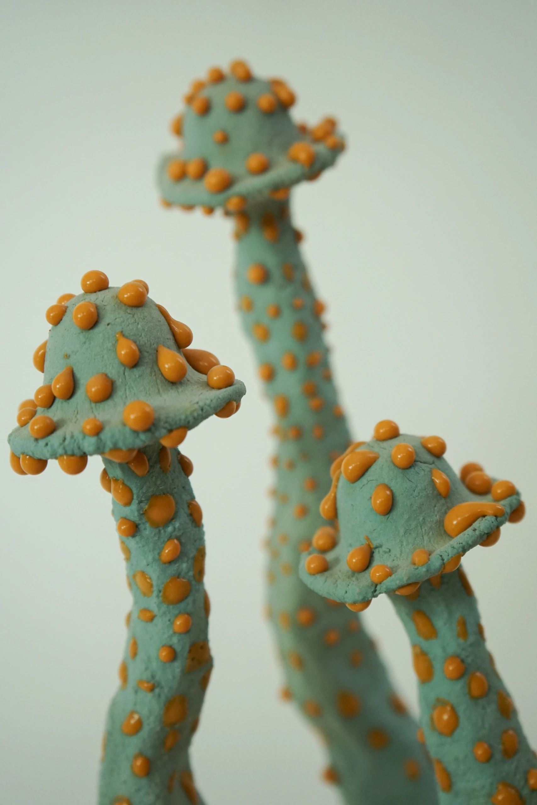 Orange Blue Roundcap (2026), ceramic sculpture by Sjors Driessen with a rounded orange mushroom-like form finished with textured blue glaze.