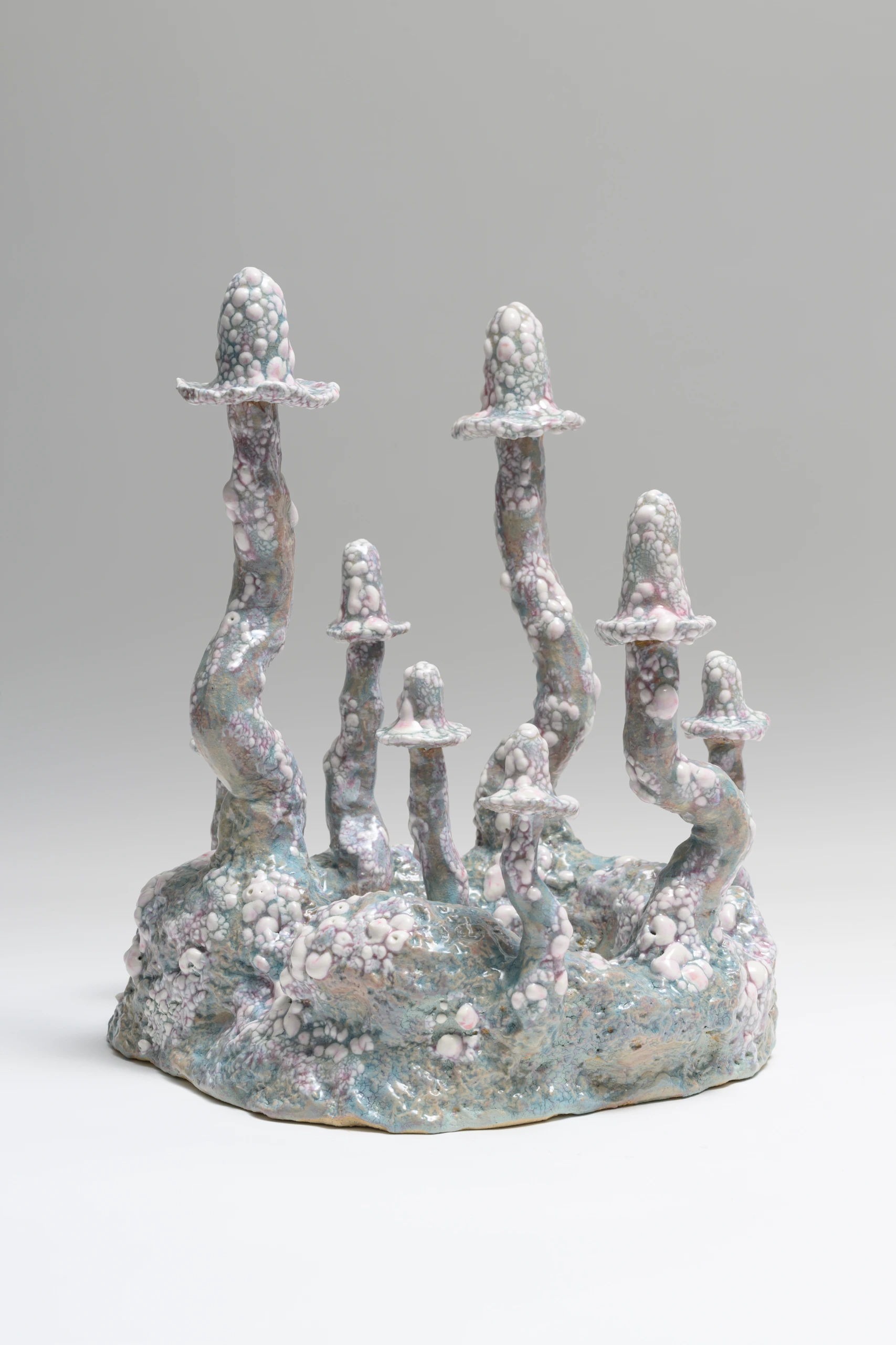 Small Blue/Purple Inkcaps (2024), ceramic wall sculpture by Sjors Driessen with small pale purple fungal growths on a light blue organic form.