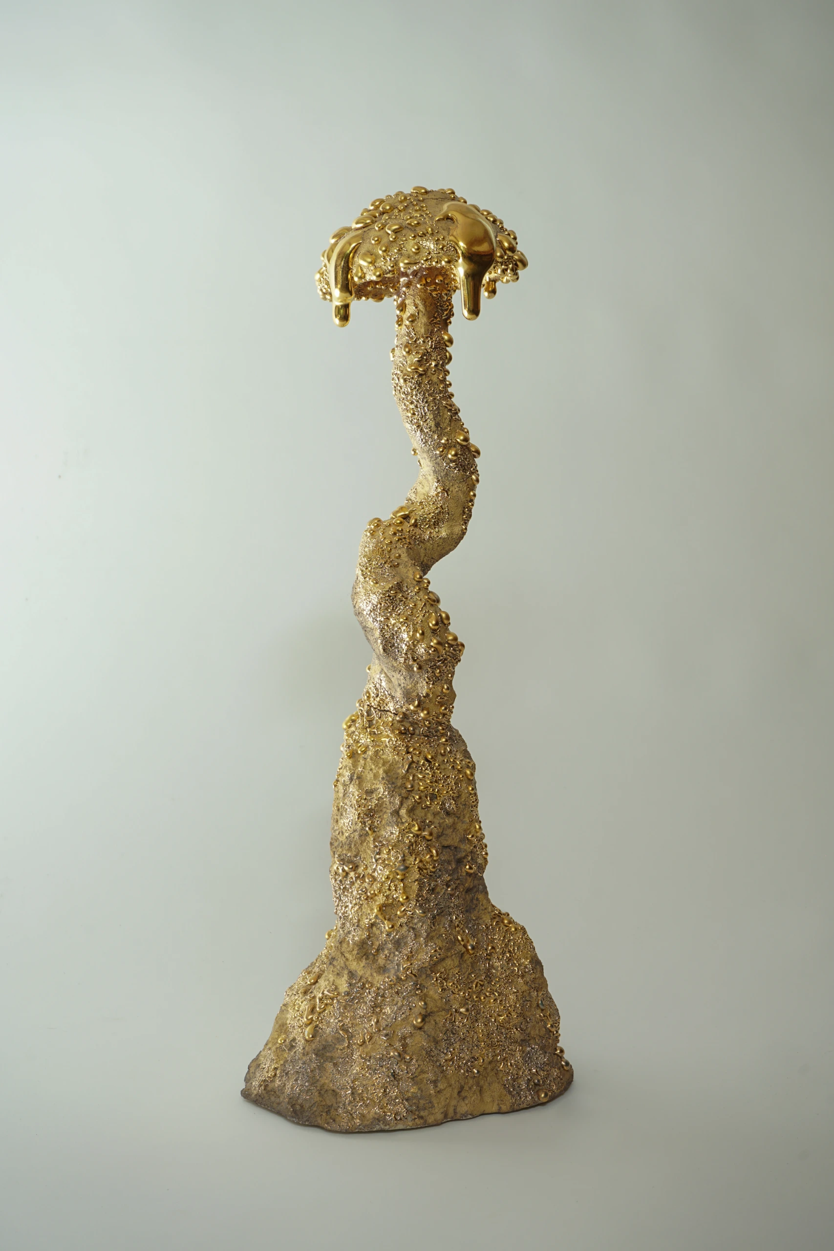 Gold Inkcap (2026), ceramic sculpture by Sjors Driessen with an elongated organic mushroom form covered in textured glaze and reflective gold lustre.