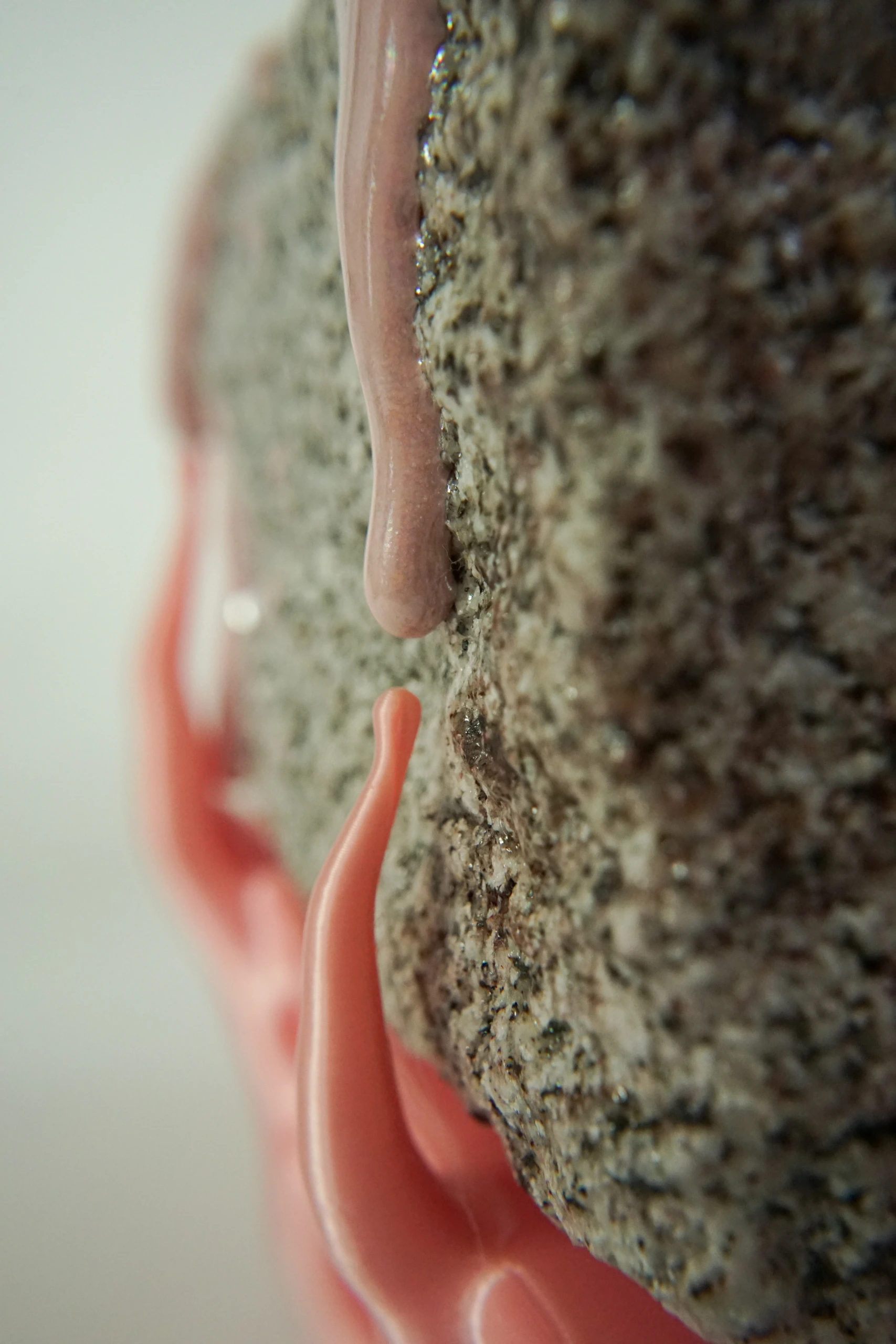 Pink Hyphae (2026), sculpture by Sjors Driessen combining granite with pink glaze and branching pink hyphae-like structures that appear to support and grow around the stone.