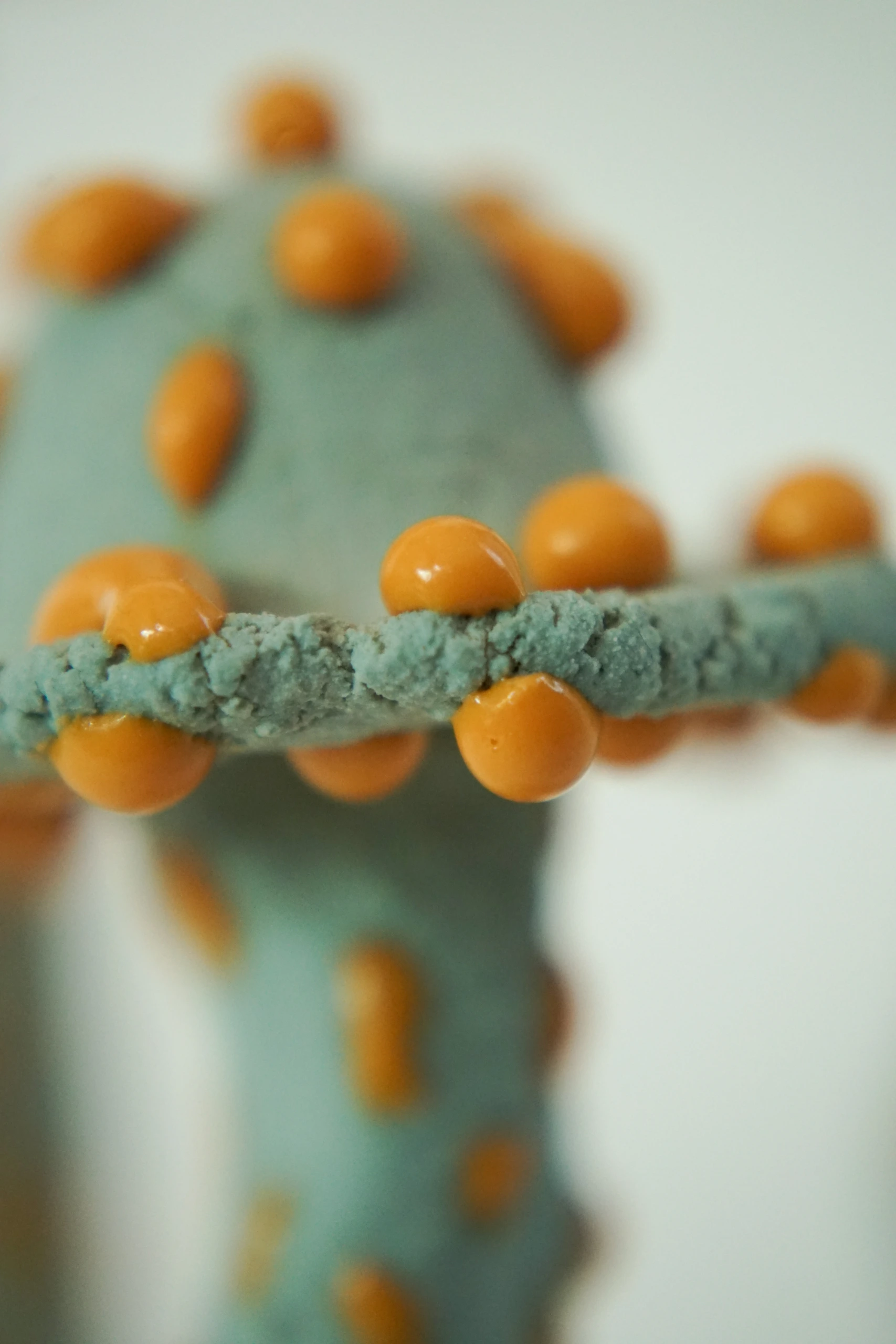 Orange Blue Roundcap (2026), ceramic sculpture by Sjors Driessen with a rounded orange mushroom-like form finished with textured blue glaze.