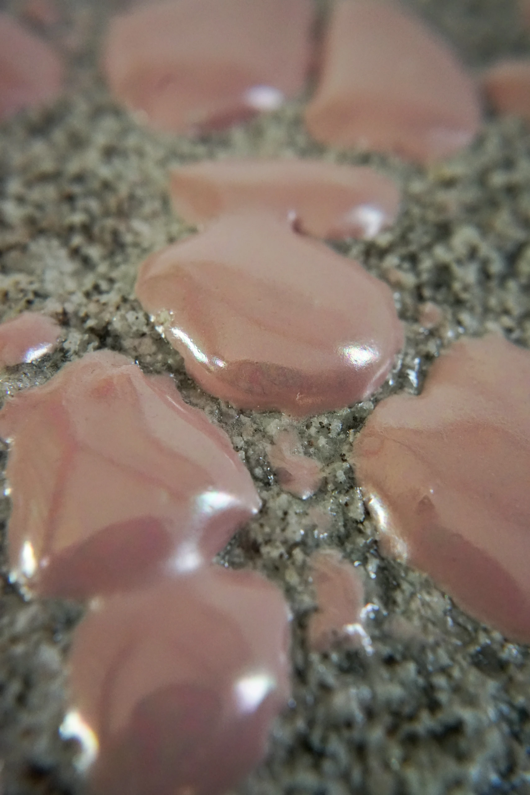Pink Hyphae (2026), sculpture by Sjors Driessen combining granite with pink glaze and branching pink hyphae-like structures that appear to support and grow around the stone.