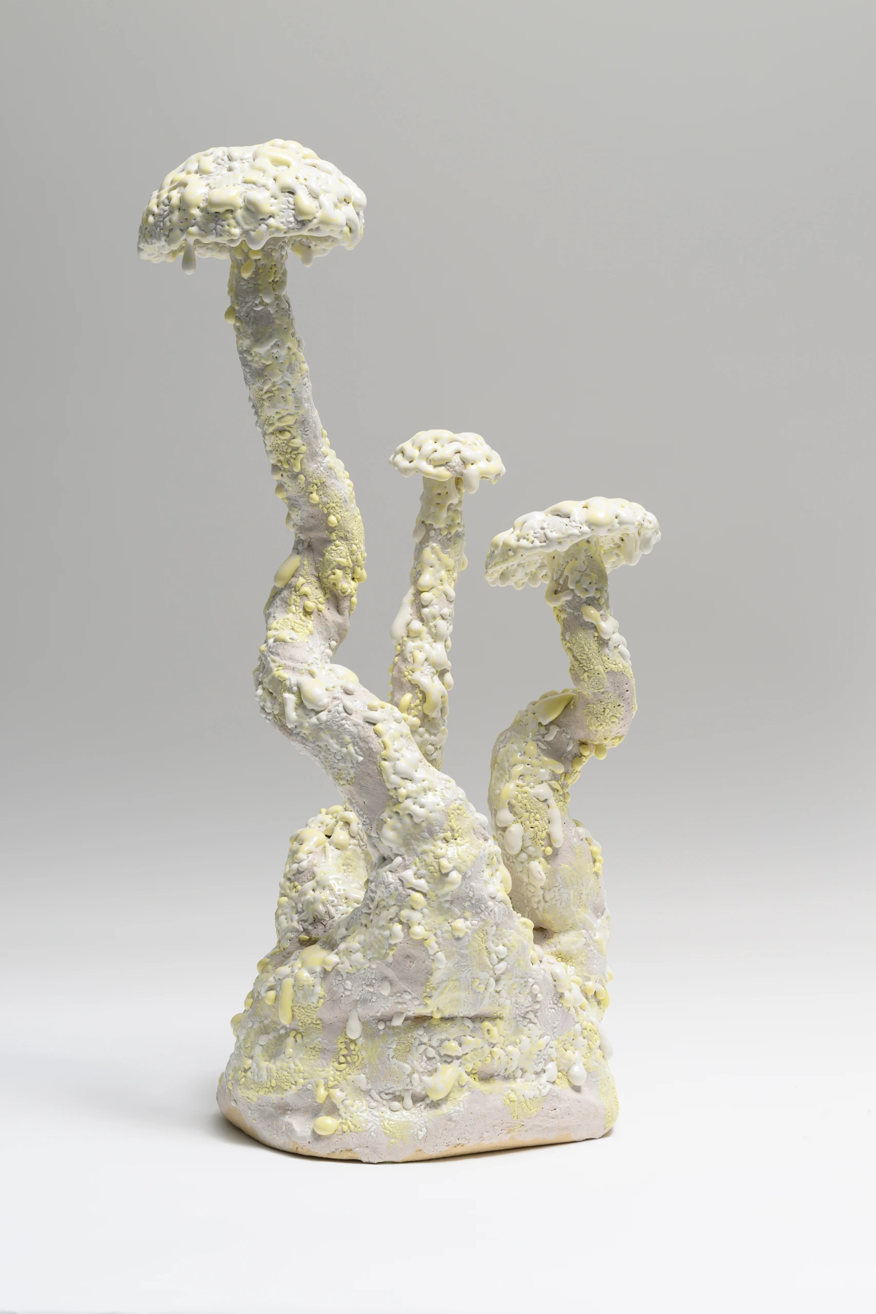 Yellow White Cort (2024), ceramic sculpture by Sjors Driessen with three elongated mushroom forms in white and pale yellow glaze.